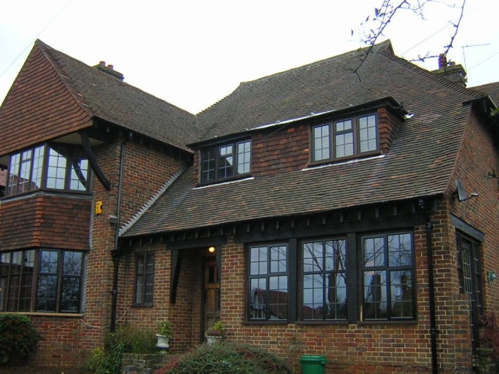 Exterior of Red Brick House With Black Details