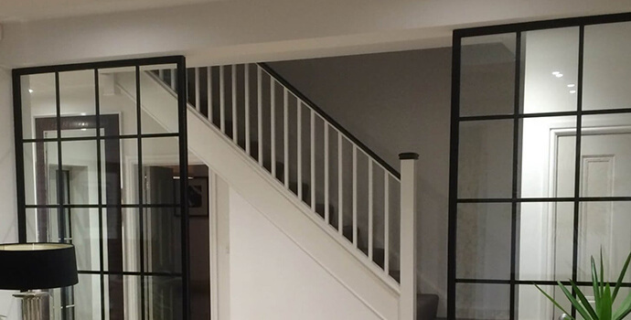 Interior Stairs with Black Window Frame Partitions