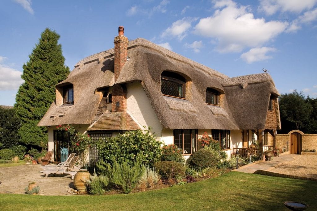 Exterior of Traditional Cottage With Thatched Roof