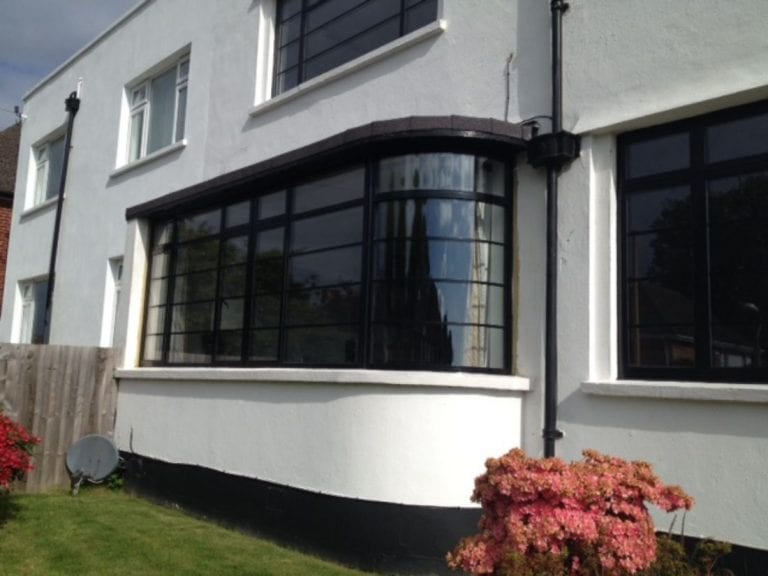 White Modern House With Black Curved Window Frame