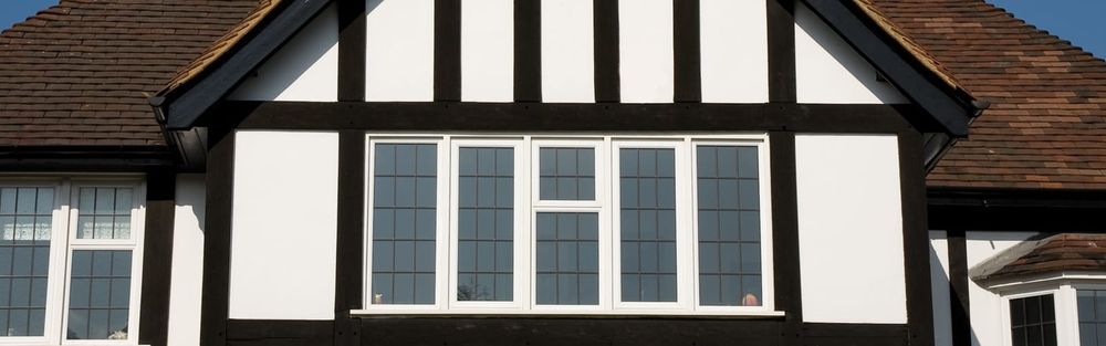 Exterior of Mock Tudor House with White Window Frames