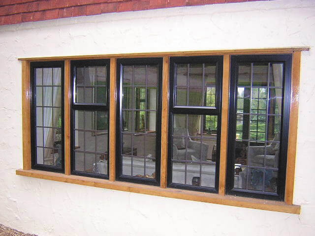 Exterior of Black Window Frames Looking into Living Room