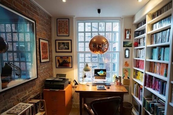 Home Study With Large Window And Bookshelves